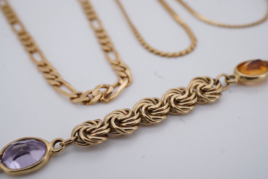 Three necklaces and two bracelets, comprising: a gold figaro chain and a flat fancy link chain, each 45cm, marked 14K, combined gross weight approximately 9 grams; a flat link necklace in gold, length 37cm, Italian maker